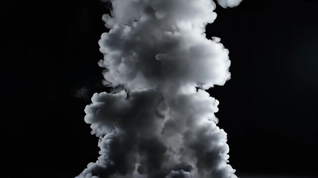 A dense white smoke column billows upwards against a dark background, creating a powerful and atmospheric vapor effect.