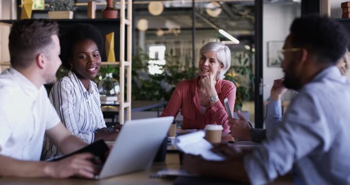 Business meeting, collaboration and teamwork in boardroom, planning and people or brainstorming. Staff, senior woman and leadership at conference, discussion and support or communication for review