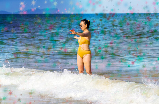 Woman in yellow swimsuit and bokeh
