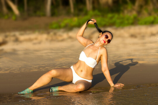 Woman body pretty with white bikini at beach
