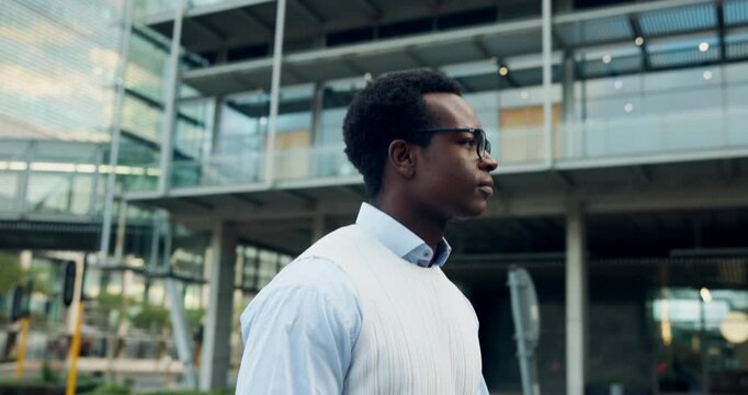 Walking, business and black man in city for morning commute, travel and journey to office. Pedestrian, corporate and person on trip for job, career and professional opportunity for work in town