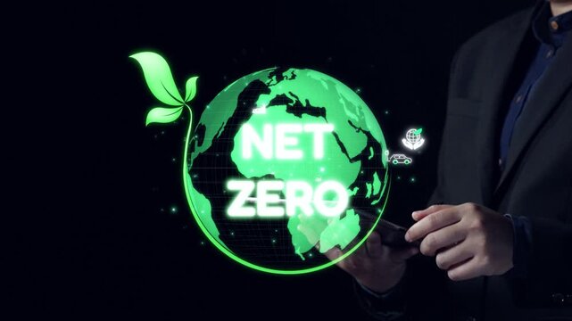 Conceptual illustration of net zero emissions featuring a globe surrounded by eco-friendly icons and green leaves with a person holding a smartphone in foreground. Qubit