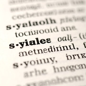 Close up of dictionary page highlighting the word yiales in focus