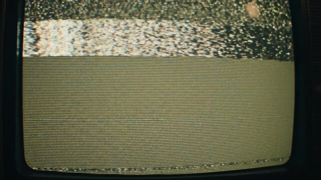 Static noise fills old television screen display