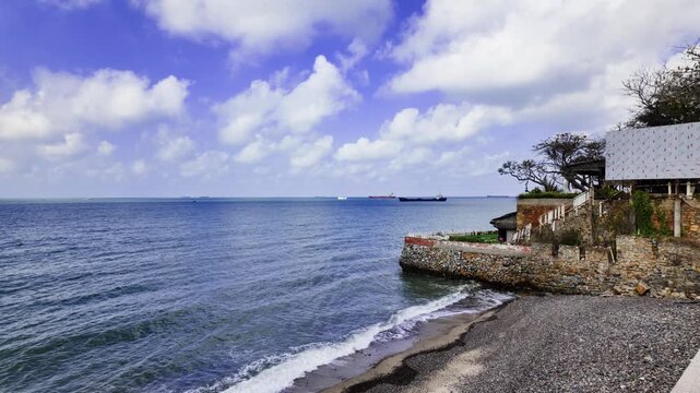 Bai Dua is located in Vung Tau. Visitors can relax on the beach, walk along the shore, and enjoy the ships sailing in the distance. It is a lovely spot for beach lovers.