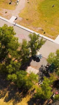 Vertical video. Balat, Turkey. Aerial drone approach to ancient Theatre of Miletus filling the frame with view of green fields. Aerial View, MasterShots, Tilt up. Rich colors