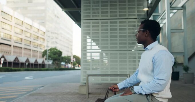 Black man, bus stop and travel with bag in city for transportation service or commute. Businessman, traveler or waiting with luggage at public station or sidewalk for ride or lift in an urban town