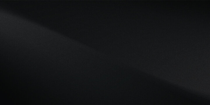 Sandblasted or brushed titanium or steel metal surface, the light reflection of the curved lines creates a smooth gradation on the dark black metallic background