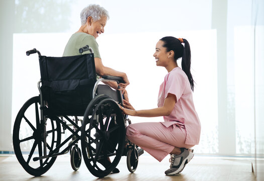 Nurse, old woman and laugh in wheelchair at window in morning, healing and funny story in retirement home. Caregiver, patient and elderly person with disability, joke and rehabilitation at house