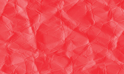 Fototapeta premium Close up of vibrant red crumpled paper texture showing intricate creases and folds