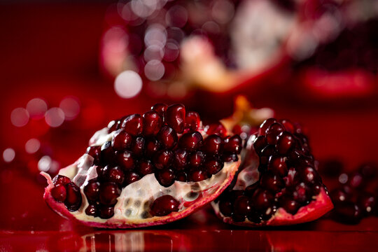Pomegranate seeds. Pomegranate with seeds. Red ruby pomegranate arils. Pomegranate grains.