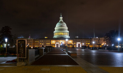 Night scene of the Capitol. Capitol dome with night lighting. Iconic Capitol dome in the evening. Historic Washington DC building. Washington DC night landmark. Panorama of the US Capitol. © Volodymyr
