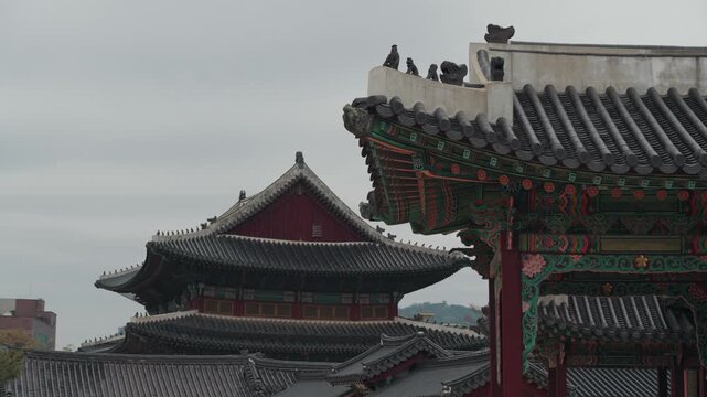 Close architectural details and roof structures of Changdeokgung Palace in Seoul South Korea showcasing traditional Korean craftsmanship and royal palace design.
