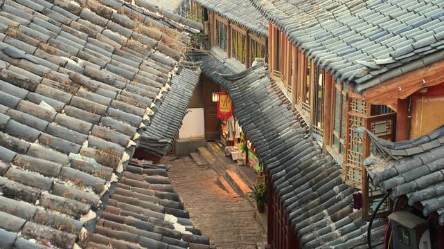 Traditional Asian old town alley with tiled rooftops