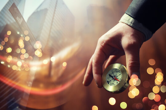 Double exposure businessman with vintage compass in a hand and skyscraper.  concept to make decision or choose direction