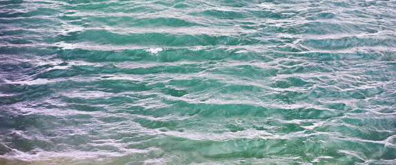 Obraz premium Water surface. The texture of the water. Waves on the lake in windy weather.