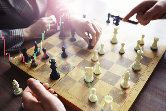 Black and White chess with player, Businessman and Businesswoman shaking hands after end game of thinking strategy to moving chess figure in competition with opposite player and planning.
