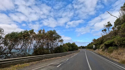 Fototapeta premium Winding Asphalt Road Along the Great Ocean Road in Victoria Australia