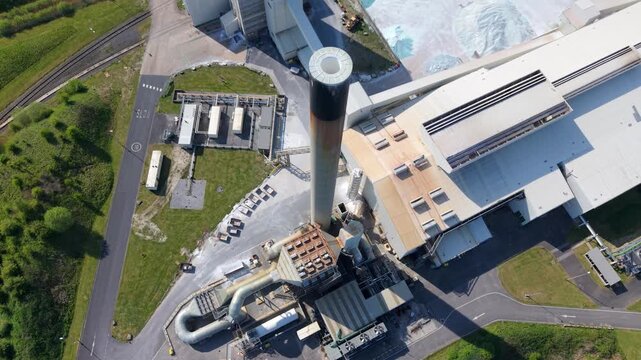 Aerial view of the Guardian Glass Production Factory featuring its tall chimney and industrial complex in Goole, England, United Kingdom.