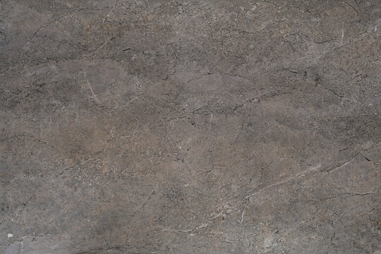 Granite texture with natural mineral speckles and rough stone variation. Durable solid surface ideal for flooring, walls, countertops, and architectural design backgrounds.