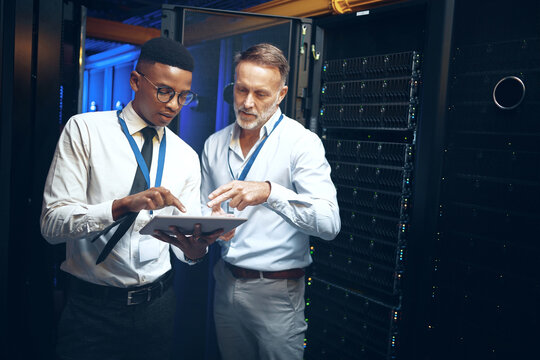 Planning, engineer or men with tablet in server room, system backup schedule or cybersecurity update. Review, firewall testing and people with mainframe maintenance, tech and team talk in data center