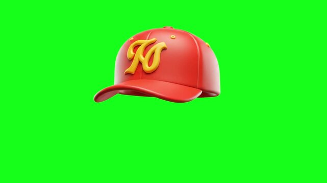 A vibrant red sports baseball hat featuring a stylized 3D yellow letter "N" on the front floats and rotates in mid-air. The asset is isolated on a solid green chroma key background for easy placement 