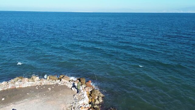 Aerial Drone Flight Over Calm Sea in Izmir Turkiye with Distant Coastline