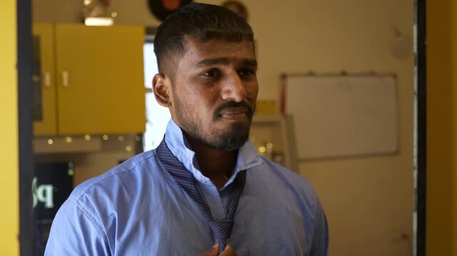 Young Indian male in office college attire adjusts tie while staring into a mirror, unhappy with acne-ridden tanned skin; an intimate bedroom moment reflecting self-image concerns and insecurity