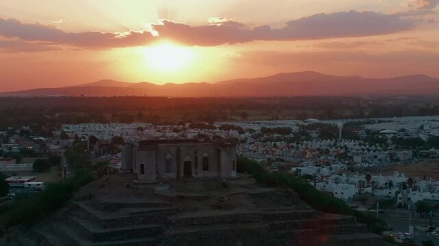 Aerial dolly in of the top of the El Cerrito archaeological site in Santiago de Queretaro, Mexico