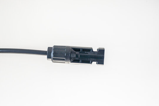 Close-up of a 2Y/3Y/4Y solar connector for parallel connection, 30A, 1000V, photovoltaic sockets for solar panel cables, on a table