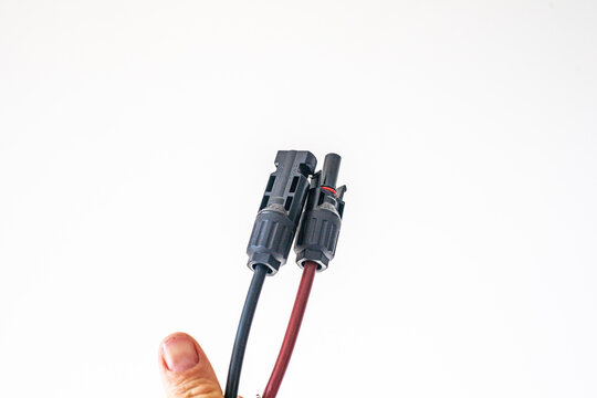 Close-up of a 2Y/3Y/4Y solar connector for parallel connection, 30A, 1000V, photovoltaic sockets for solar panel cables, on a table