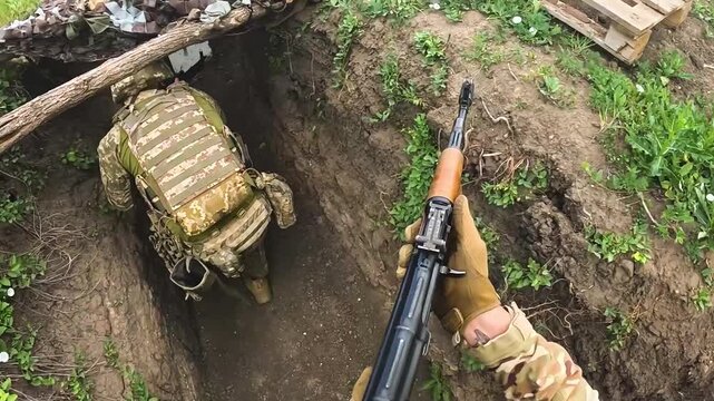 Two infantry soldiers moving cautiously along a trench, crouching and periodically firing in the direction of the enemy. Concept of frontline combat, military tactics, and coordinated movement under