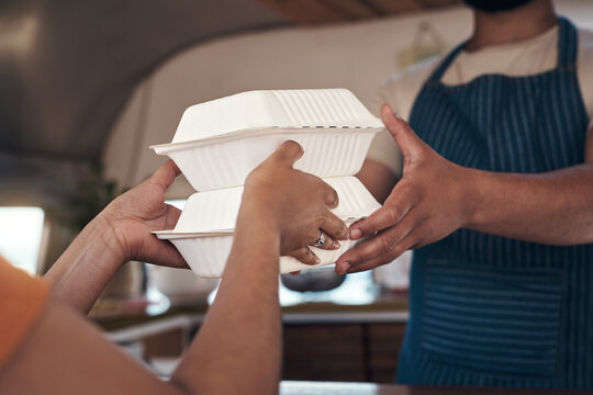 Hands, woman and server with food at restaurant for purchase, customer service and takeaway order. Vendor, disposable container and giving parcel with person, packaged meal and takeout collection
