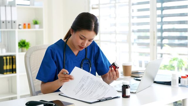 professional doctor doing paperwork checking medical documents at workplace. Concentrated physician reading medic form analyzing patient diagnosis or report in hospital.