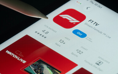 Fototapeta premium Dhaka, Bangladesh- 30 Oct 2025: F1 TV app on a iPad screen with a pen pointing at the install option.