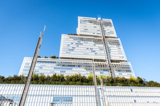 Paris, France - April 7, 2026: Low angle view of the "Tribunal de Paris" (Courthouse of Paris), a 38 storeys, 160 metres high building by architect Renzo Piano, seen from the Parvis Robert Badinter.