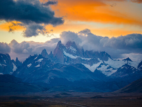Fitz Roy peaks glowing in fiery sunset clouds, Patagonia Argentina