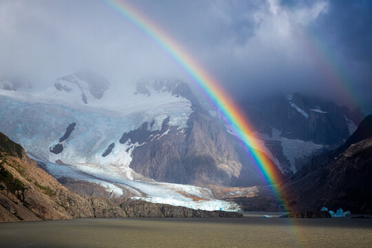 Rainbow over glacier lake and rugged mountains in Patagonia Argentina