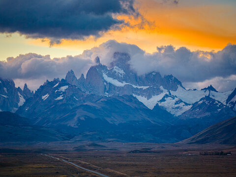 Fitz Roy peaks glowing in fiery sunset clouds, Patagonia Argentina