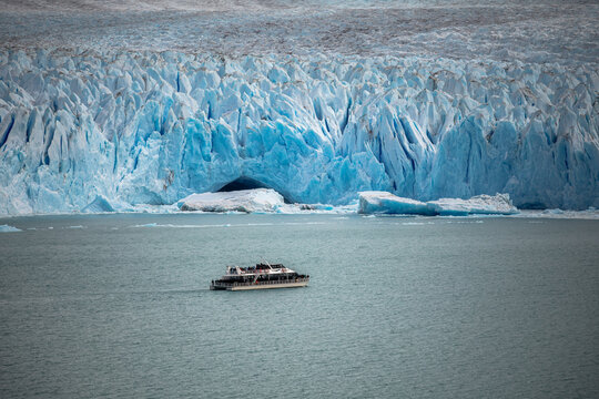 Tour boat near Perito Moreno Glacier ice wall, Patagonia Argentina