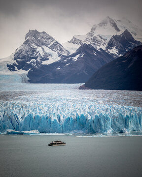 Tour boat dwarfed by Perito Moreno Glacier, Patagonia Argentina