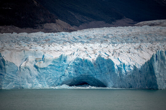 Tour boat dwarfed by Perito Moreno Glacier, Patagonia Argentina