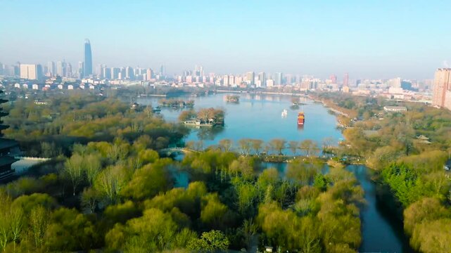 Daming Lake Park and Jinan city skyline in China