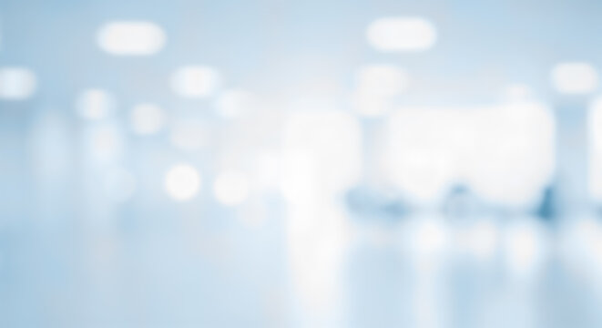 Abstract blurred interior hospital clinic office bright light blue white background defocus empty modern spacious hall room clinical medical healthcare design element