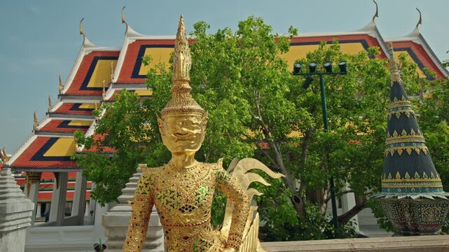 Golden kinnara statue at Wat Phra Kaew in Bangkok, ornate Thai temple architecture and mythology landmark in Thailand