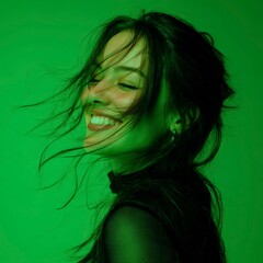 Naklejka premium Woman laughing with hair blowing in the wind