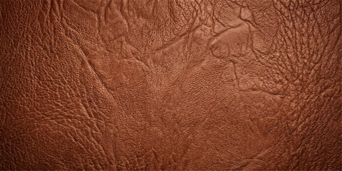 Fototapeta premium A close-up photograph showcases the rich texture and natural beauty of weathered, brown leather, offering a tactile experience through the visual.