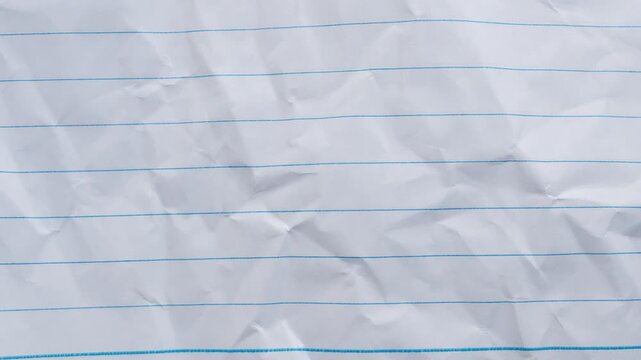 Blank crumpled lined notebook paper texture background stop motion
