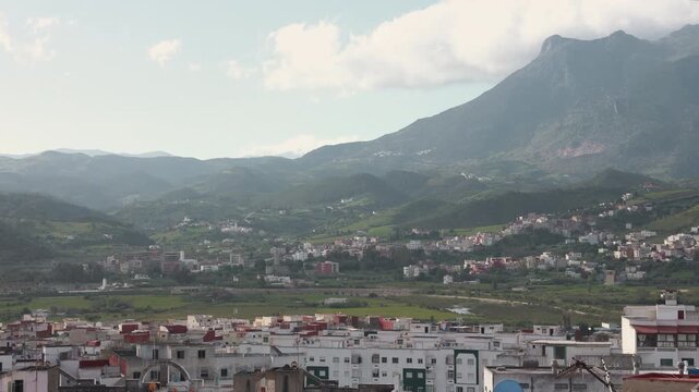 Panoramic view of Tetouan, Morocco with the Rif Mountains in the background and clouds moving in the sky