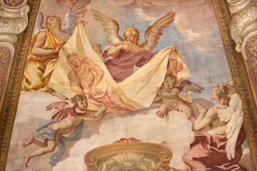 Obraz premium CREMA, ITALY - MARCH 20, 2026: The fresco of angels with the Crucifixion instruments (shroud of Turin) in cupola of the church Santuario di Santa Maria della Croce by Giacomo Parravicino (1702). 